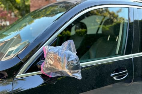 bag over car mirror|putting bags over mirrors.